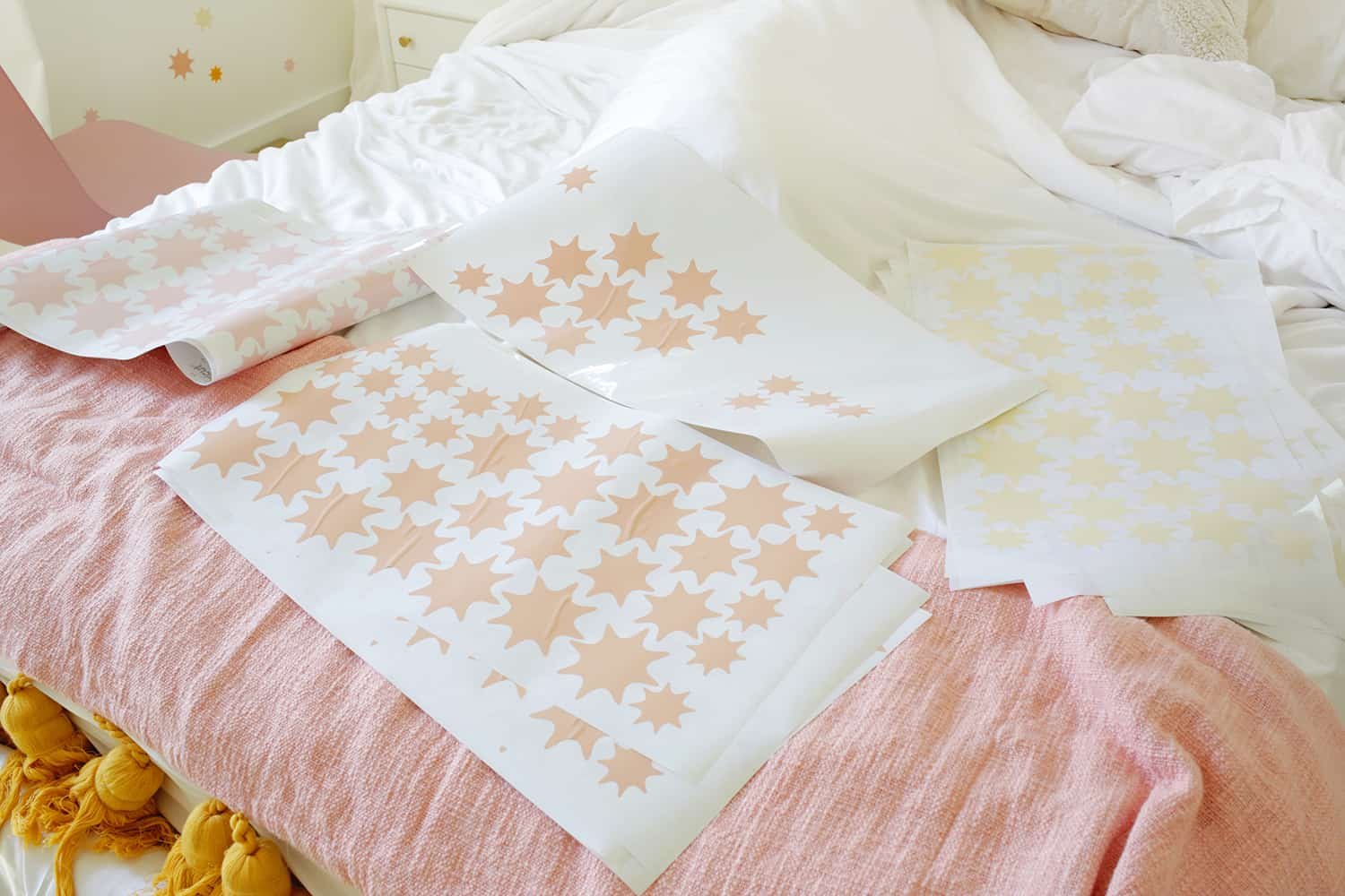 sheets of cutout stars for star wallpaper DIY