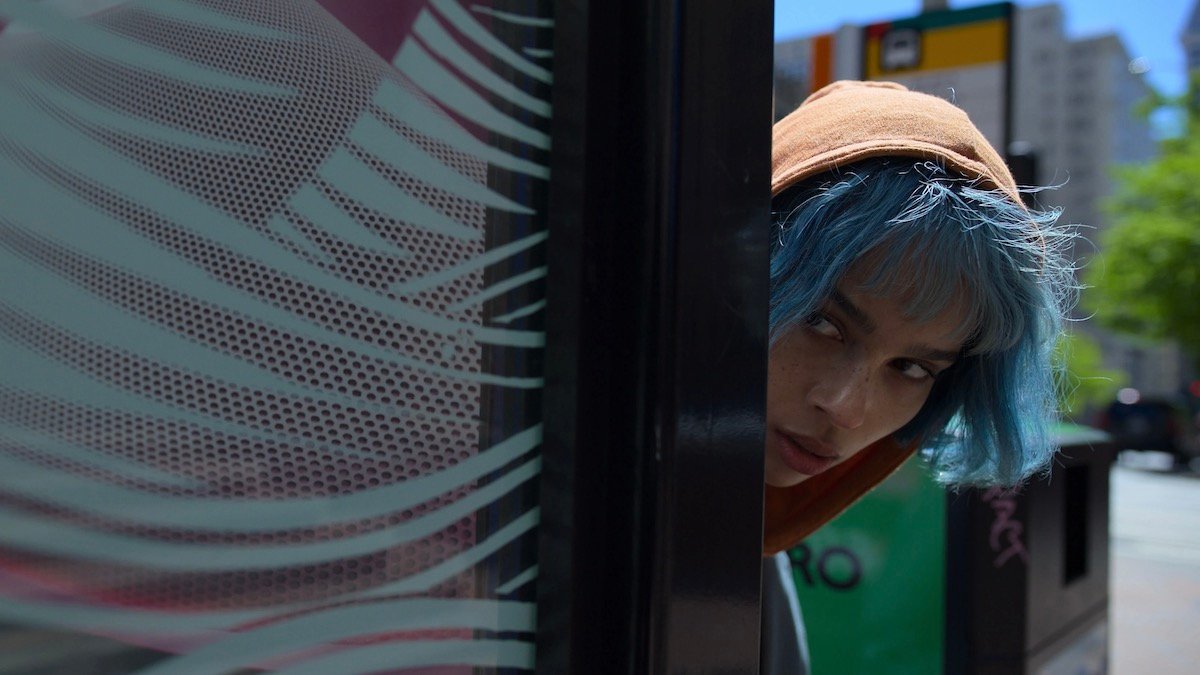 Zoe Kravitz peaks around a door in Kimi — best new streaming movies