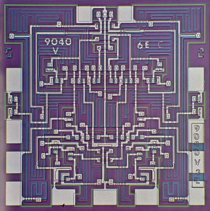 A Fairchild 9040 integrated circuit juxtaposed with a geometrically patterned rug