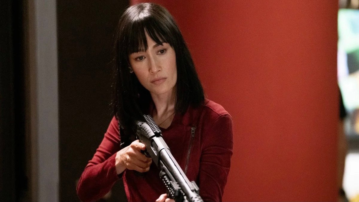 Maggie Q holds a rifle in The Protege - best new streaming movies